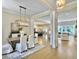 Open concept dining room with chandelier, hardwood floors, and kitchen view at 195 Prestwick Ct, Summerville, SC 29483