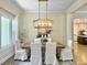 Bright dining area with a modern chandelier, hardwood floors, and natural light at 195 Prestwick Ct, Summerville, SC 29483