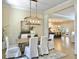 Elegant dining room with hardwood floors, a chandelier, and views of the kitchen at 195 Prestwick Ct, Summerville, SC 29483