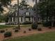Charming one-story home features neutral siding, black shutters, and manicured landscaping at 195 Prestwick Ct, Summerville, SC 29483