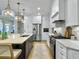 Bright kitchen features white cabinets, stainless steel appliances, and an island with seating at 195 Prestwick Ct, Summerville, SC 29483