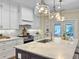 Bright kitchen featuring marble countertops, stainless steel appliances and white cabinetry at 195 Prestwick Ct, Summerville, SC 29483