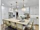 Bright kitchen features an island with seating, white cabinets, and stainless steel appliances at 195 Prestwick Ct, Summerville, SC 29483