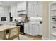 Bright kitchen features white cabinets, stainless steel appliances, and ample counter space at 195 Prestwick Ct, Summerville, SC 29483