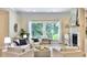 Sunlit living space with large windows, fireplace, and neutral decor is great for entertaining or relaxing at 195 Prestwick Ct, Summerville, SC 29483