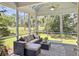 Relaxing screened porch with comfortable seating and beautiful golf course views at 195 Prestwick Ct, Summerville, SC 29483