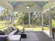Outdoor screened porch providing backyard views, stylish furniture, and an open-air feel at 195 Prestwick Ct, Summerville, SC 29483
