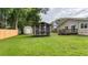 Backyard featuring green lawn, a shed, and a screened-in gazebo at 212 Kentucky Dr, Ladson, SC 29456