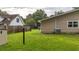 The backyard has a large grassy area, and includes an AC unit at 212 Kentucky Dr, Ladson, SC 29456