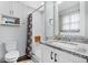 Modern bathroom with sleek fixtures, updated vanity, and walk-in shower with a seat at 212 Kentucky Dr, Ladson, SC 29456