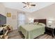Bedroom featuring wood-look floors, ceiling fan, and comfortable bed with nightstands at 212 Kentucky Dr, Ladson, SC 29456