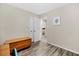 Bedroom with wood-look flooring, closet, and view into adjacent room at 212 Kentucky Dr, Ladson, SC 29456