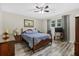 Comfortable bedroom featuring a ceiling fan, natural light, and stylish wood-look floors at 212 Kentucky Dr, Ladson, SC 29456