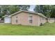 Side view of the house shows well-maintained lawn and brick veneer at 212 Kentucky Dr, Ladson, SC 29456