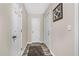 Hallway with neutral walls, new flooring, and white doors at 212 Kentucky Dr, Ladson, SC 29456