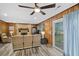 Spacious living room with wood-paneled walls, fireplace, and hard surface floors at 212 Kentucky Dr, Ladson, SC 29456