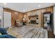Inviting living room with brick fireplace, wood accents, and updated flooring at 212 Kentucky Dr, Ladson, SC 29456