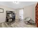 Spacious office with wood-look flooring, desk, chair, and shelving for storage at 212 Kentucky Dr, Ladson, SC 29456