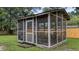 An outdoor screened in porch, with seating, for relaxing or dining at 212 Kentucky Dr, Ladson, SC 29456