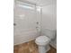 Bathroom with tub and shower combination featuring a white toilet and a tiled floor at 213 Crossandra Ave, Summerville, SC 29483