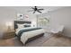 Cozy bedroom with stylish decor, ceiling fan, and bright natural light at 213 Crossandra Ave, Summerville, SC 29483