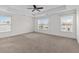 Spacious bedroom featuring a ceiling fan and multiple windows, allowing for ample natural light at 213 Crossandra Ave, Summerville, SC 29483