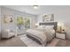 Inviting bedroom with a decorative rug, upholstered bed, and natural light at 213 Crossandra Ave, Summerville, SC 29483