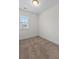This bedroom features neutral carpet and trim, a window with blinds, and lots of natural light at 213 Crossandra Ave, Summerville, SC 29483