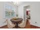 Cozy breakfast nook with natural light, hardwood floors and backyard views at 213 Crossandra Ave, Summerville, SC 29483