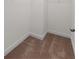 The walk-in closet has neutral carpet and trim, with ample space for storage at 213 Crossandra Ave, Summerville, SC 29483