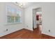 Bright, empty room with hardwood floors and natural light, perfect for customization at 213 Crossandra Ave, Summerville, SC 29483