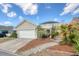 Charming two-story home with a garage, and a covered patio area at 213 Crossandra Ave, Summerville, SC 29483