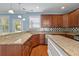 Spacious kitchen featuring granite counters, stainless appliances, and ample cabinetry at 213 Crossandra Ave, Summerville, SC 29483