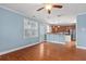 A view of a living room with hardwood floors that connects to the kitchen area at 213 Crossandra Ave, Summerville, SC 29483