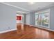Sunlit living room with hardwood floors and open access to the dining area at 213 Crossandra Ave, Summerville, SC 29483