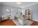 Stylish office space with desk, bookshelf, and ample natural light at 213 Crossandra Ave, Summerville, SC 29483