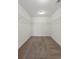 Walk-in closet with metal shelving and neutral carpeting at 213 Crossandra Ave, Summerville, SC 29483