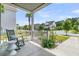 Charming front porch with rocking chairs and a view of the neighborhood at 2219 Kemmerlin St, Johns Island, SC 29455
