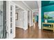 Elegant hallway with hardwood floors, decorative accents, and a glimpse into other beautifully designed rooms at 2219 Kemmerlin St, Johns Island, SC 29455