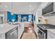 Stylish kitchen features white cabinets and a large island, connecting the culinary space to a cozy living area at 2219 Kemmerlin St, Johns Island, SC 29455