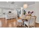 Bright, open layout showcases a modern kitchen, dining area with chandelier, and seamlessly connected living spaces at 2219 Kemmerlin St, Johns Island, SC 29455