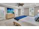 Spacious main bedroom with a ceiling fan, neutral decor, and ensuite bathroom at 2219 Kemmerlin St, Johns Island, SC 29455