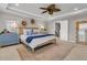 Main bedroom with a ceiling fan, neutral decor, and a door to a walk-in closet at 2219 Kemmerlin St, Johns Island, SC 29455