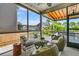 The screened in porch is comfortably furnished creating a cozy outdoor living space at 2219 Kemmerlin St, Johns Island, SC 29455