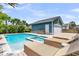 Inviting pool and spa with a garage, surrounded by lush landscaping, ideal for relaxation at 2219 Kemmerlin St, Johns Island, SC 29455