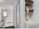 Functional laundry area with utility sink, overhead storage, and easy access to the upstairs hallway and bedrooms at 2241 Dewees Creek Dr, Mount Pleasant, SC 29466