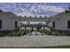Inviting pool entrance showcasing a beautifully landscaped walkway and glimpses of the refreshing pool area at 2241 Dewees Creek Dr, Mount Pleasant, SC 29466