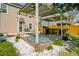 Outdoor living area with a pergola, kitchen and deck perfect for outdoor entertaining at 236 Emerald Isle Dr, Moncks Corner, SC 29461