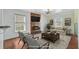 Cozy living room features a fireplace, stone accent wall, and comfortable seating with digitally altered elements at 236 Emerald Isle Dr, Moncks Corner, SC 29461