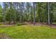 Mature trees create a private and serene backyard setting on this property, perfect for nature lovers at 242 Cheyenne Rd, Summerville, SC 29483